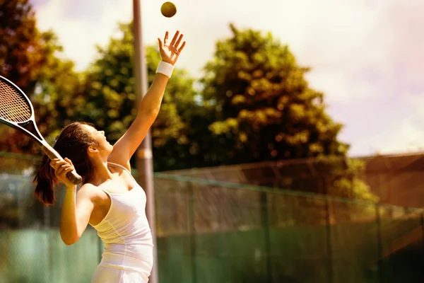 Tennis player serving