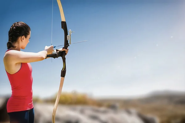 Woman practicing archery