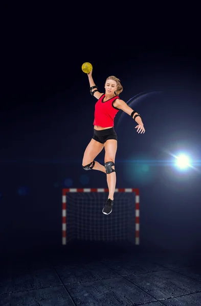Athlete with elbow pads throwing handball
