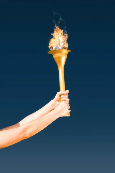 Sporty woman holding Olympic torch