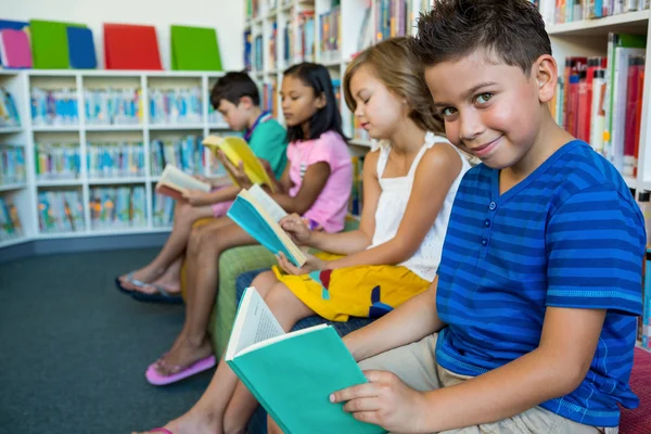 Elementary students reading books