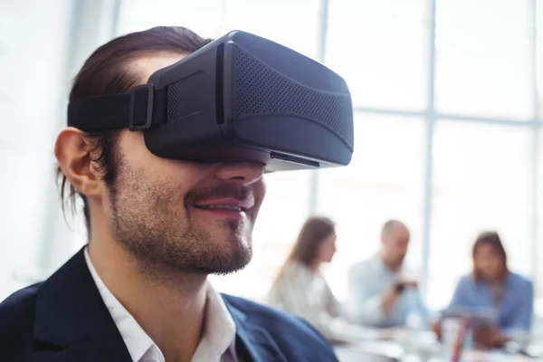 Businessman using virtual reality simulator