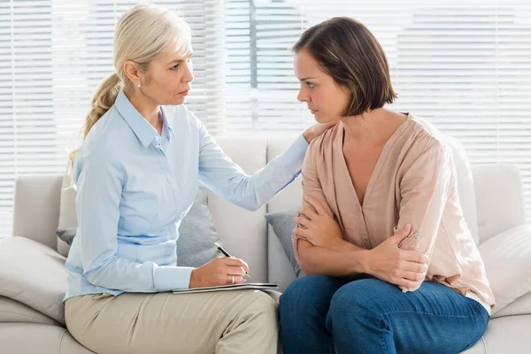 Woman listening to therapist