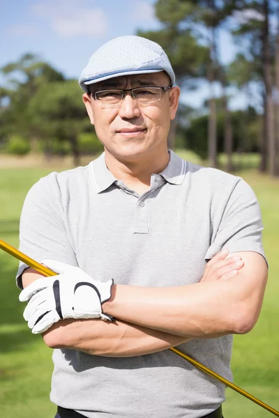 Golfer with arms crossed