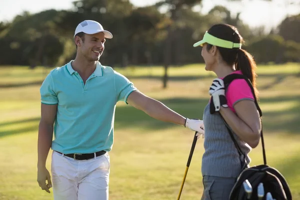 Happy golf player couple