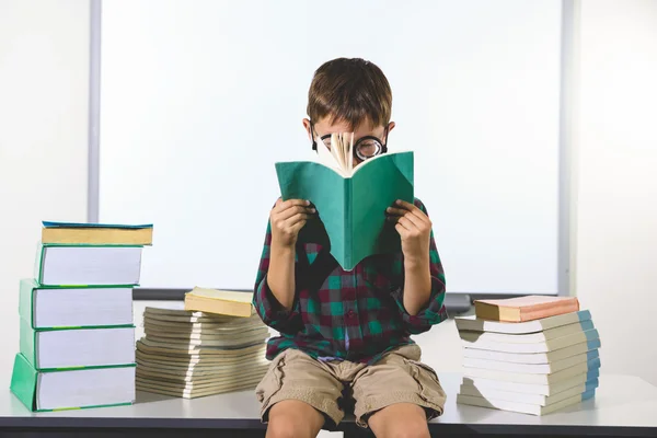 Elementary boy reading book