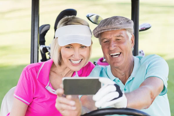 Mature couple taking selfie