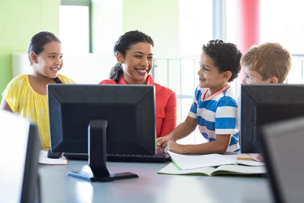 Happy female teacher with children