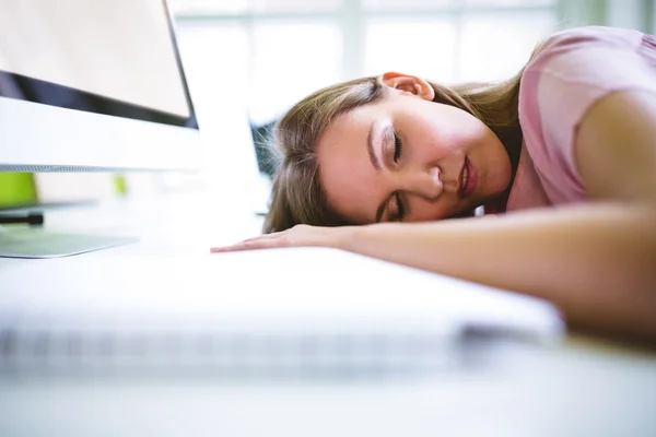 Tired female graphic designer sleeping
