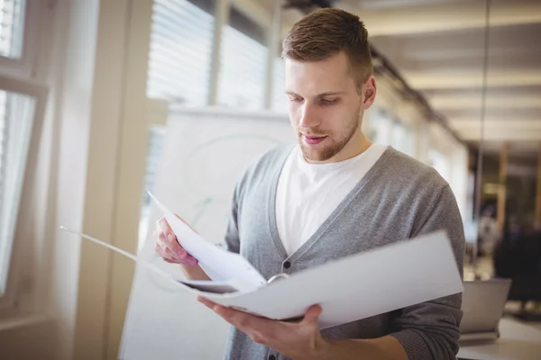 Young businessman holding file