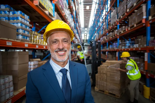 Portrait of happy manager is posing