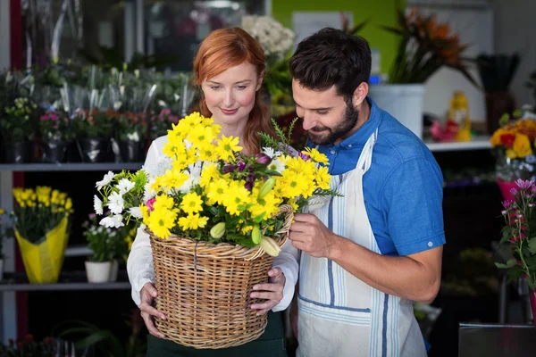 Couple standing with flower basket