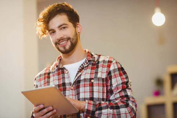 Portrait of graphic designer using digital tablet