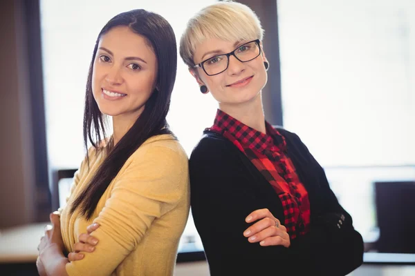 Portrait of graphic designers standing with arms crossed