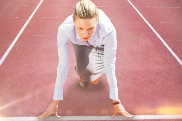 Businesswoman in starting blocks