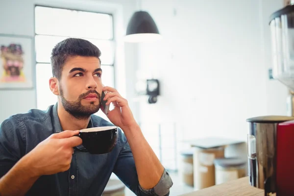 Graphic designer having coffee