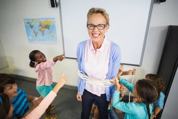 Students tying the teacher up