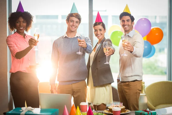 Portrait of business people celebrating birthday