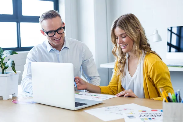 Man and woman working in creative office