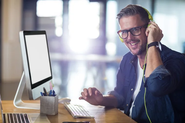 man with headphones sitting