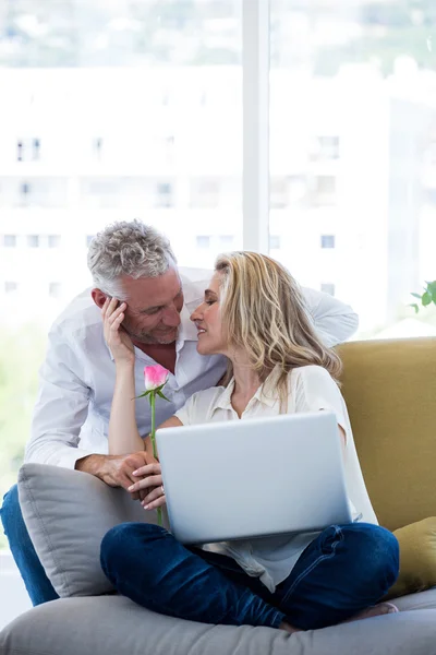 Couple with rose and laptop