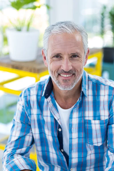 Happy mature man in restaurant