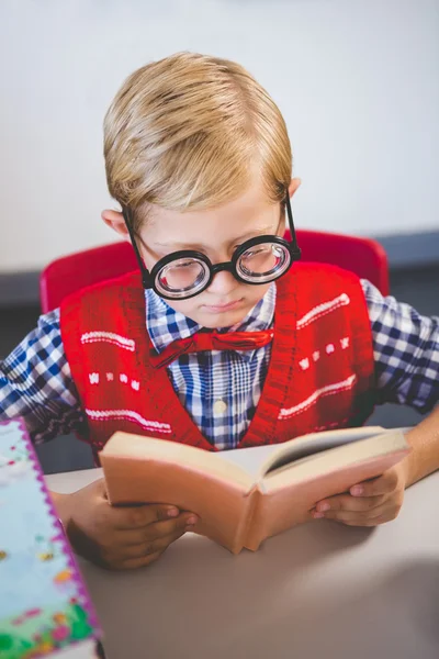 Close-up of schoolkid pretending to be a teacher in classroom