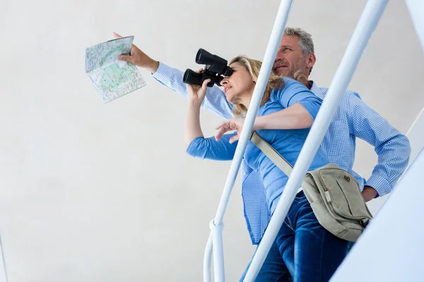 Woman looking through binoculars