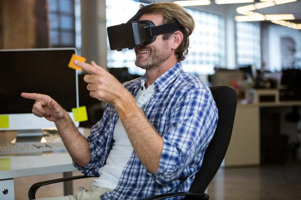Businessman using virtual reality simulator