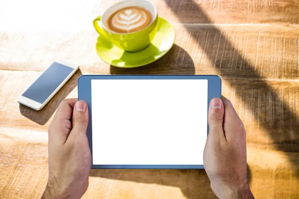 Cropped image of person holding tablet