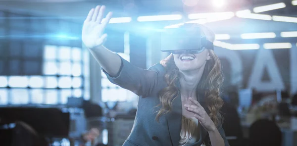 Cheerful woman using virtual reality simulator