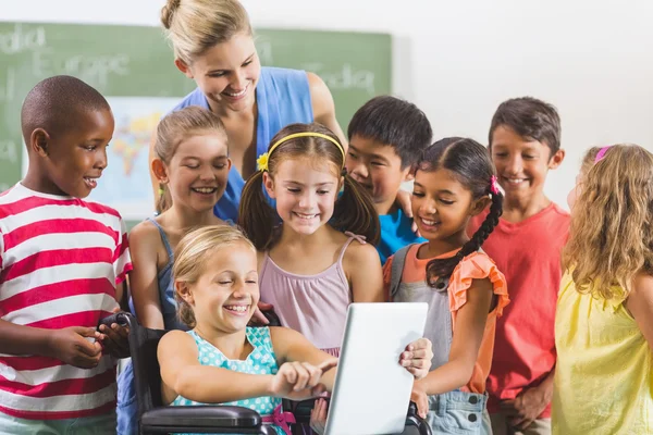 Teacher and kids using digital tablet