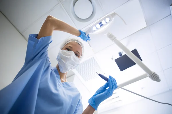 Dental assistant in surgical mask