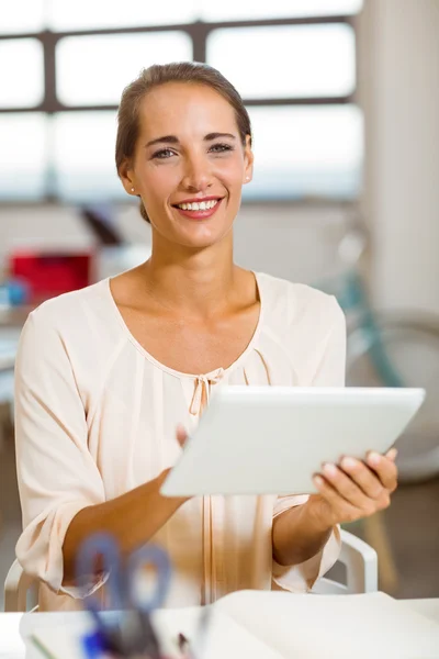 Business executive using digital tablet in office