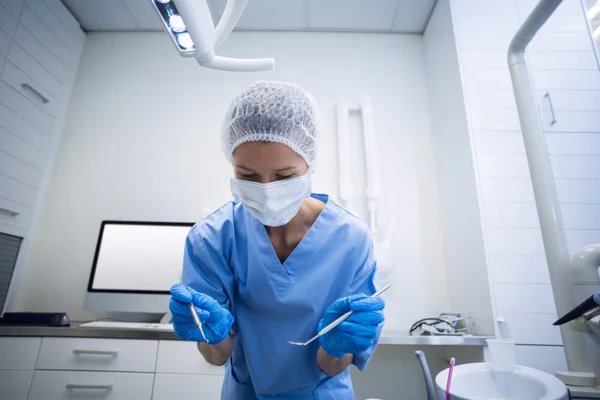 Dental assistant in surgical mask