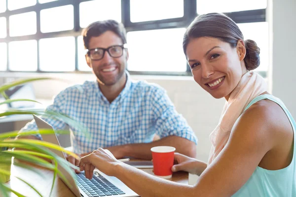 Business executives smiling in office