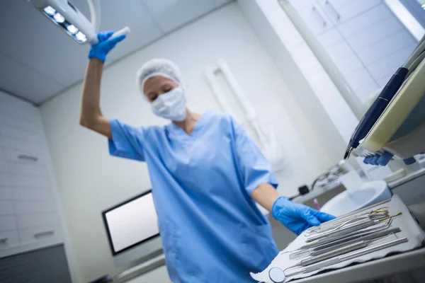 Dental assistant holding tray