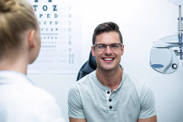 Smiling patient in ophthalmology clinic