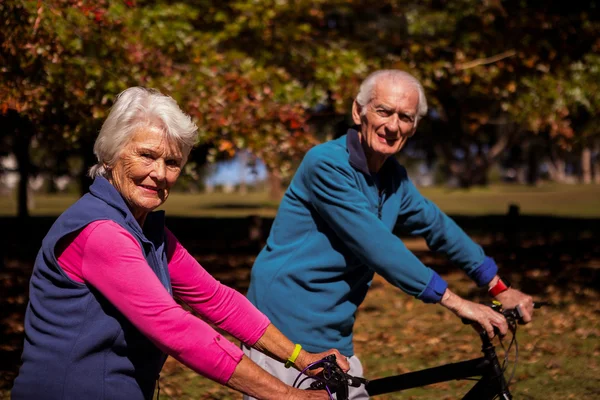 Elderly couple biking