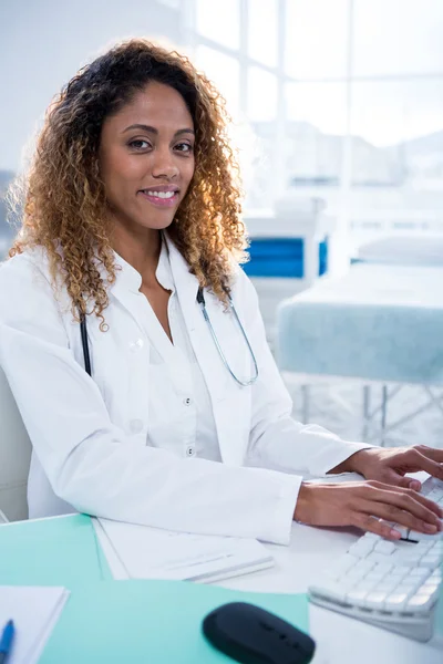 Portrait of physiotherapist working on computer