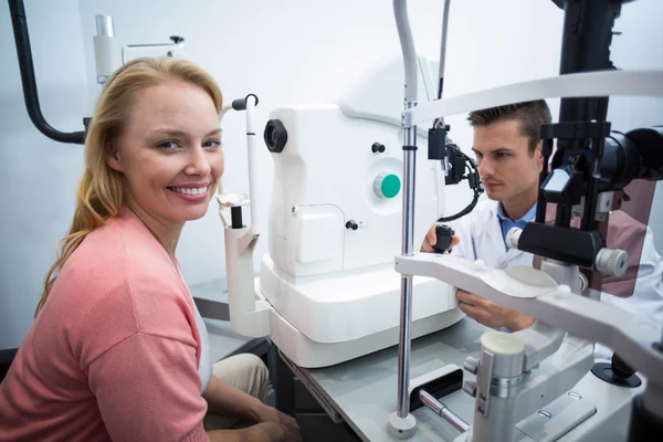 Female patient smiling in ophthalmology clinic