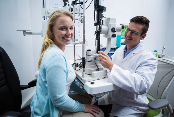 Portrait of female patient smiling in ophthalmology clinic