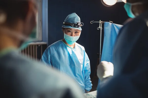 Female surgeon in operation room