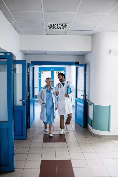 Doctors walking together in corridor
