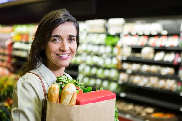 Woman holding a grocery bag