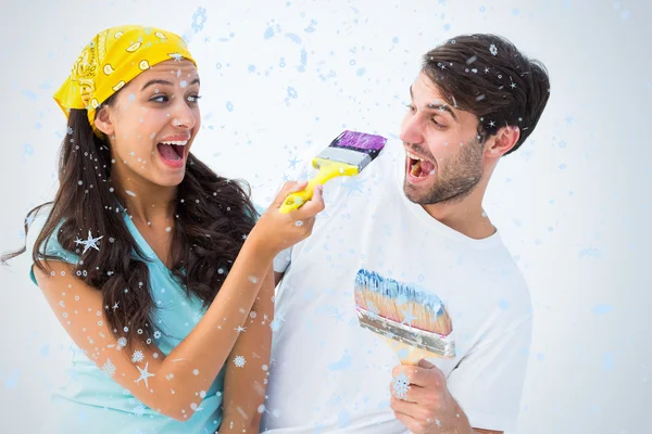 Happy young couple painting together