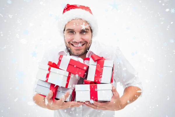 Handsome festive man holding gifts