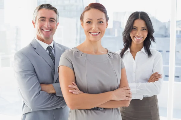 Businesswoman smiling with folded arms