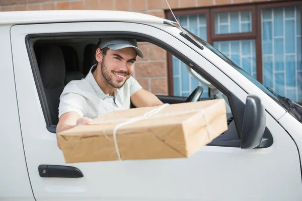 Delivery driver offering parcel