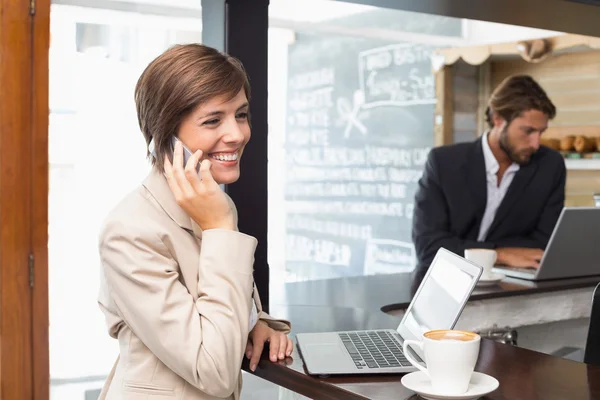 Pretty businesswoman working on her break